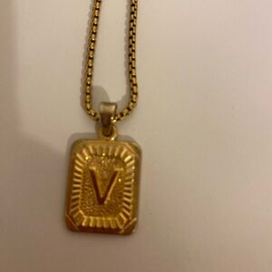 V necklace with back gold.